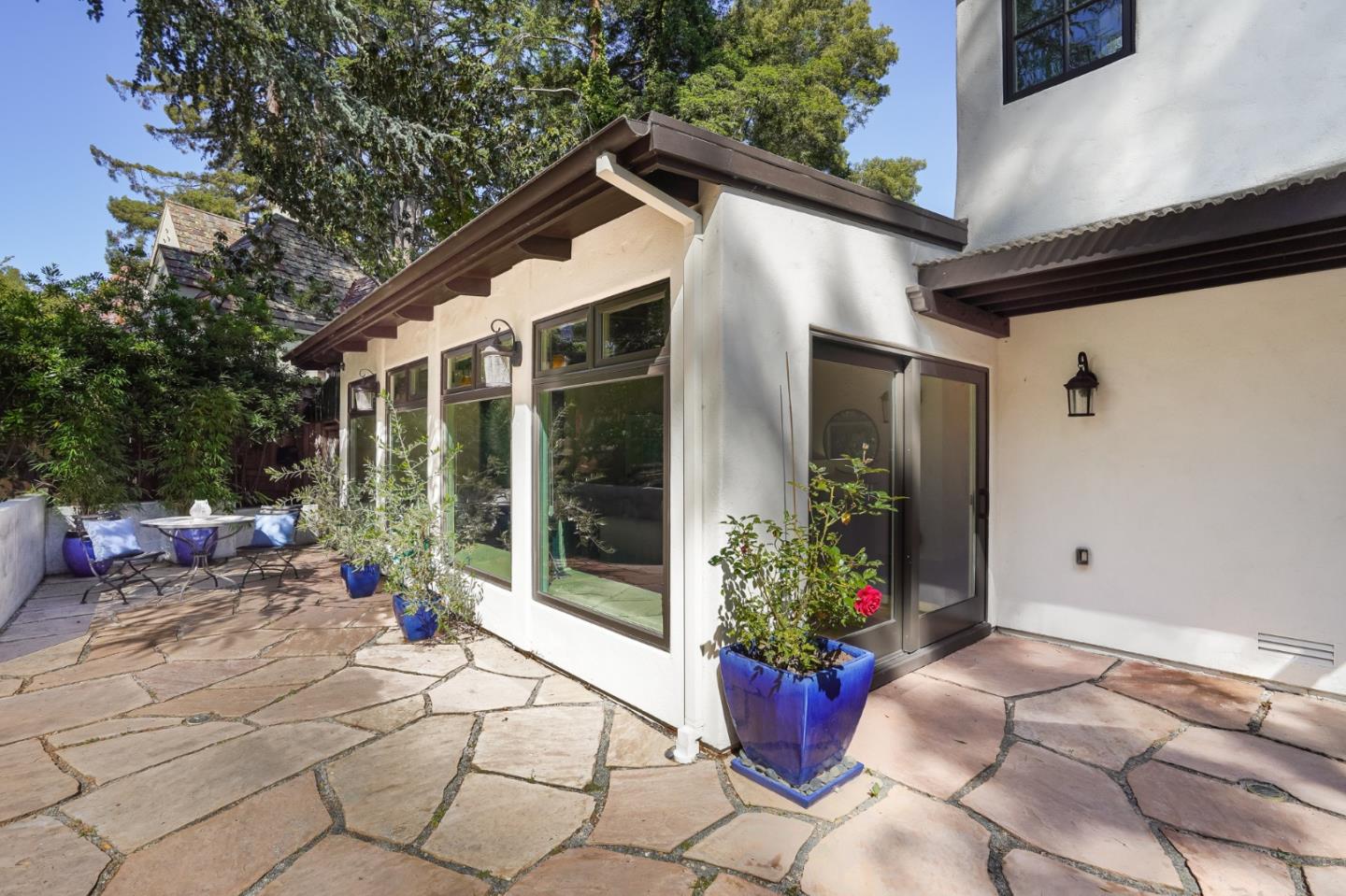472 Edgewood Road San Mateo, CA 94402 - Photo 68 of 77 a patio with table and chairs and potted plants
