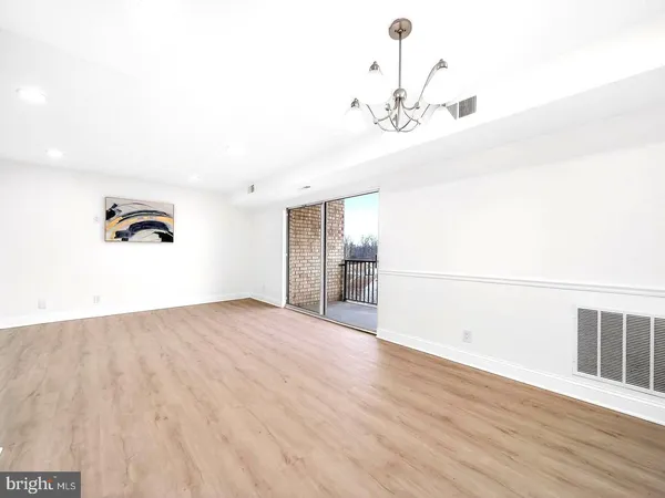 a view of a livingroom with wooden floor