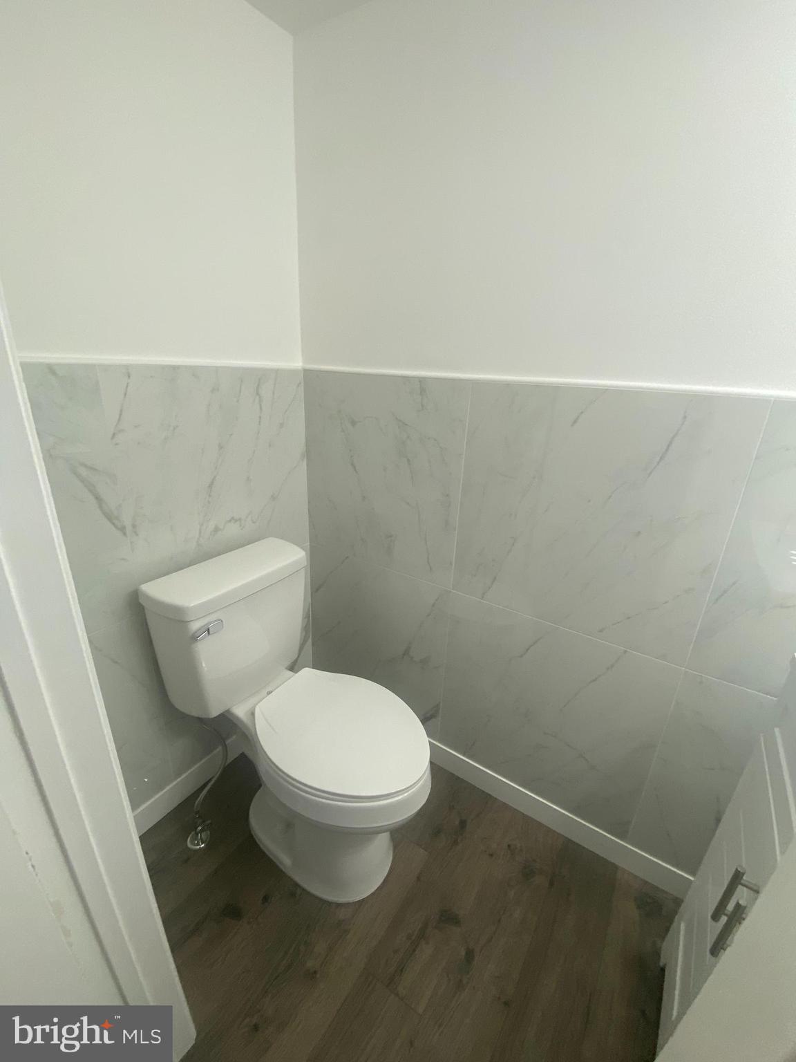 532 Cormorant Drive Voorhees, NJ 08043 - Photo 11 of 28 a white toilet sitting next to a white sink and a vanity