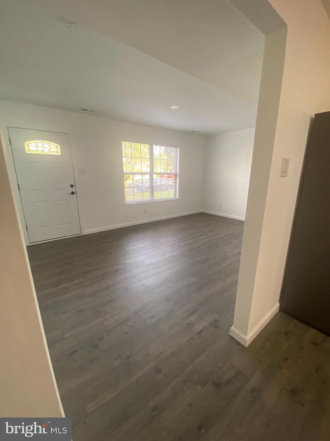 532 Cormorant Drive Voorhees, NJ 08043 - Photo 12 of 28 an empty room with wooden floor and windows