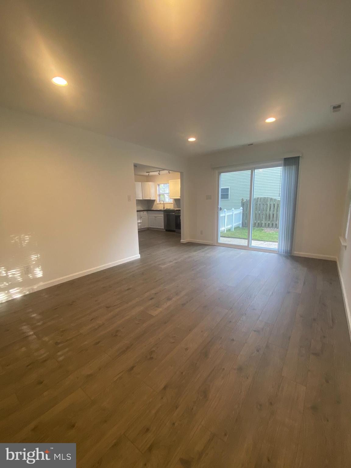 532 Cormorant Drive Voorhees, NJ 08043 - Photo 15 of 28 an empty room with wooden floor and windows