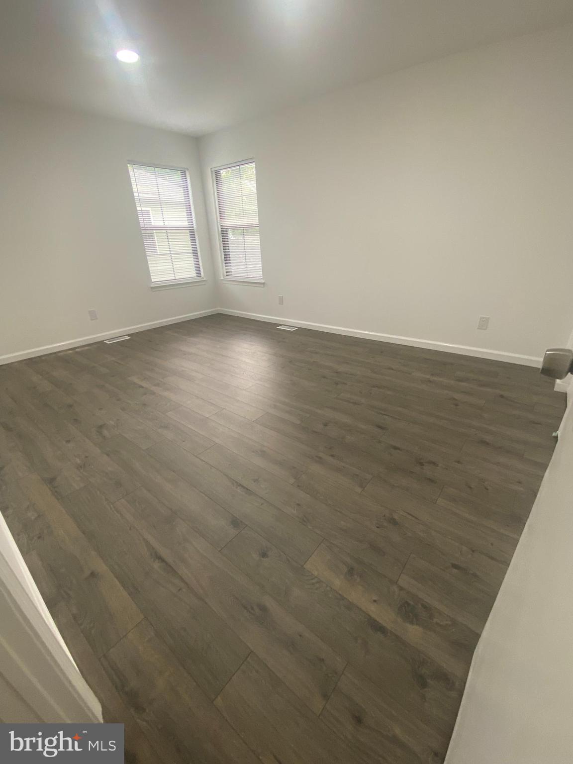 532 Cormorant Drive Voorhees, NJ 08043 - Photo 20 of 28 an empty room with wooden floor and windows