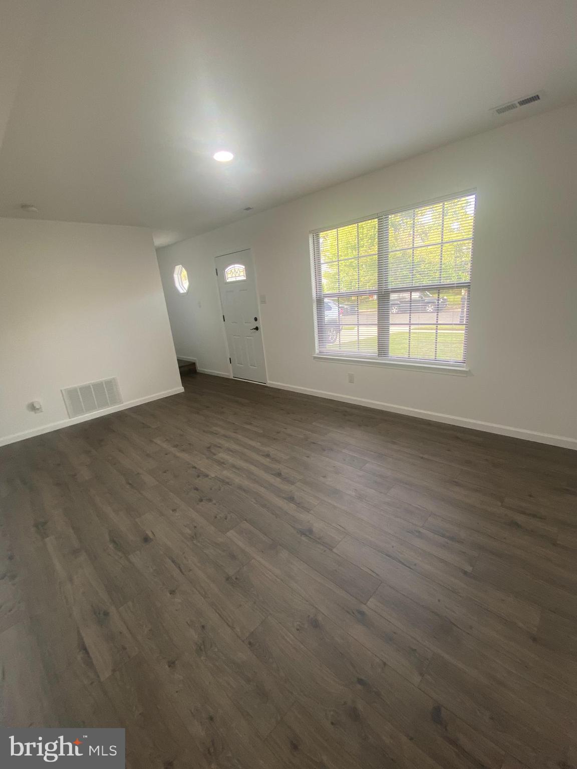 532 Cormorant Drive Voorhees, NJ 08043 - Photo 2 of 28 an empty room with wooden floor and windows