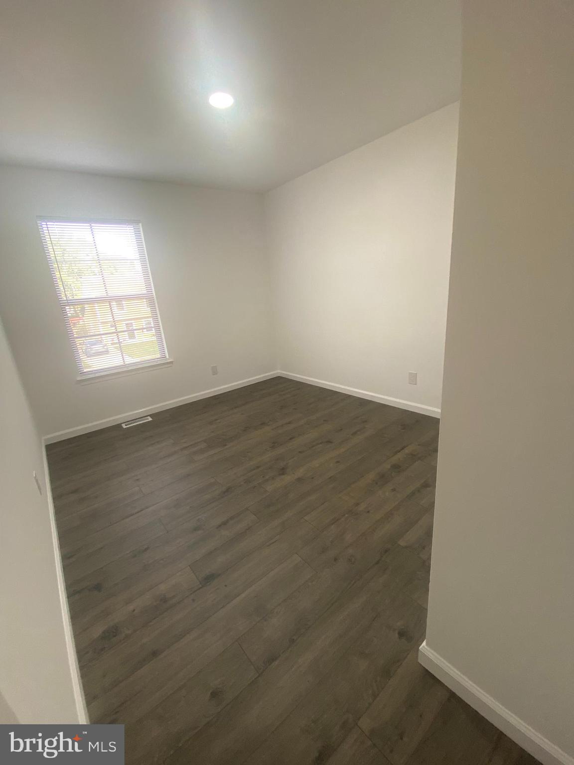 532 Cormorant Drive Voorhees, NJ 08043 - Photo 23 of 28 an empty room with wooden floor and windows