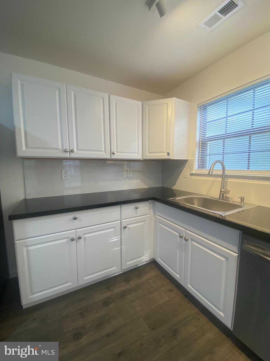 532 Cormorant Drive Voorhees, NJ 08043 - Photo 5 of 28 a kitchen with granite countertop white cabinets and sink
