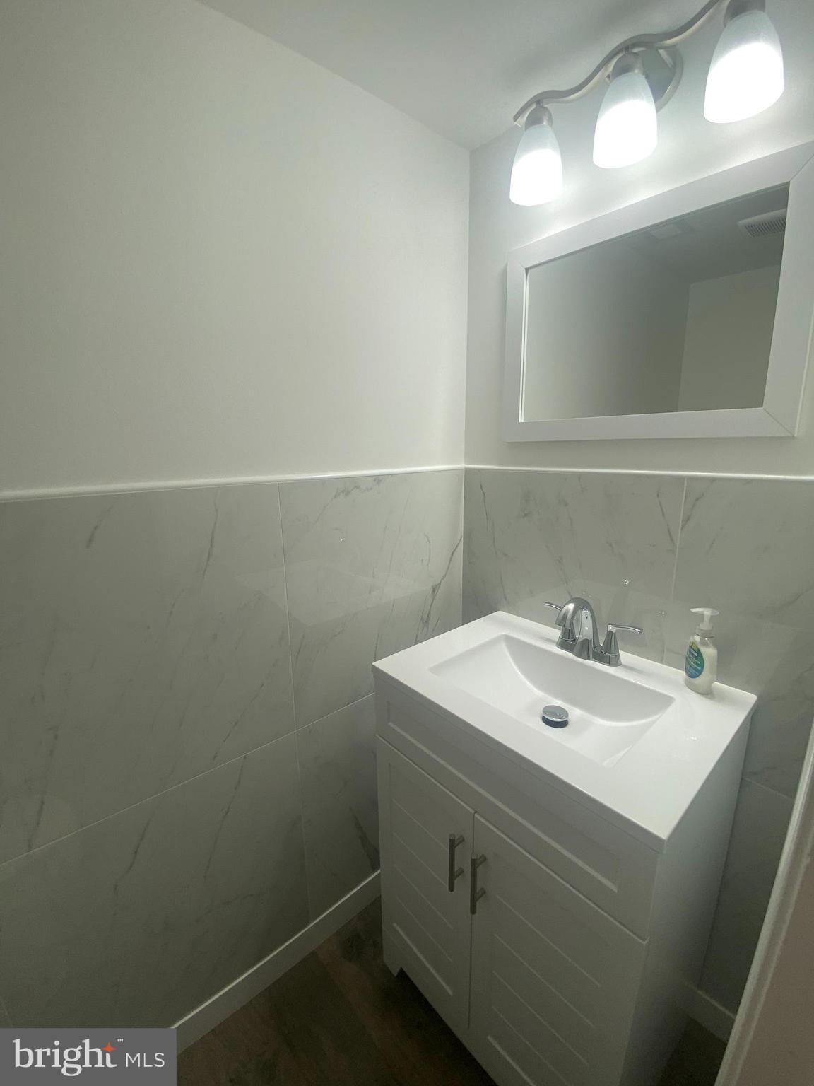 532 Cormorant Drive Voorhees, NJ 08043 - Photo 10 of 28 a bathroom with a sink and a mirror