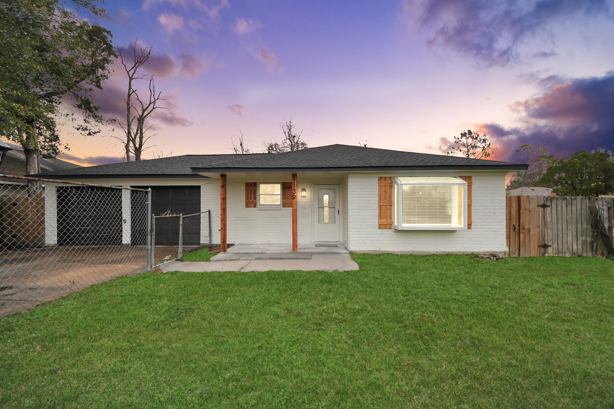 1139 Hartwick Road Houston, TX 77037 - Photo 1 of 38 a front view of a house with a garden and yard