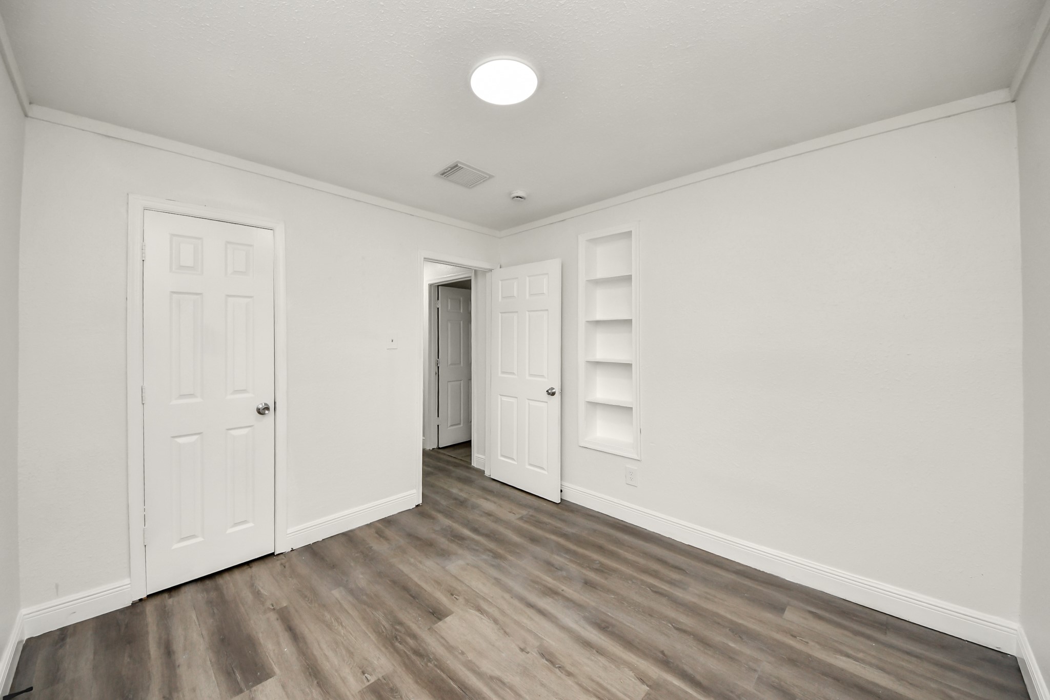 1139 Hartwick Road Houston, TX 77037 - Photo 32 of 38 a view of empty room with wooden floor