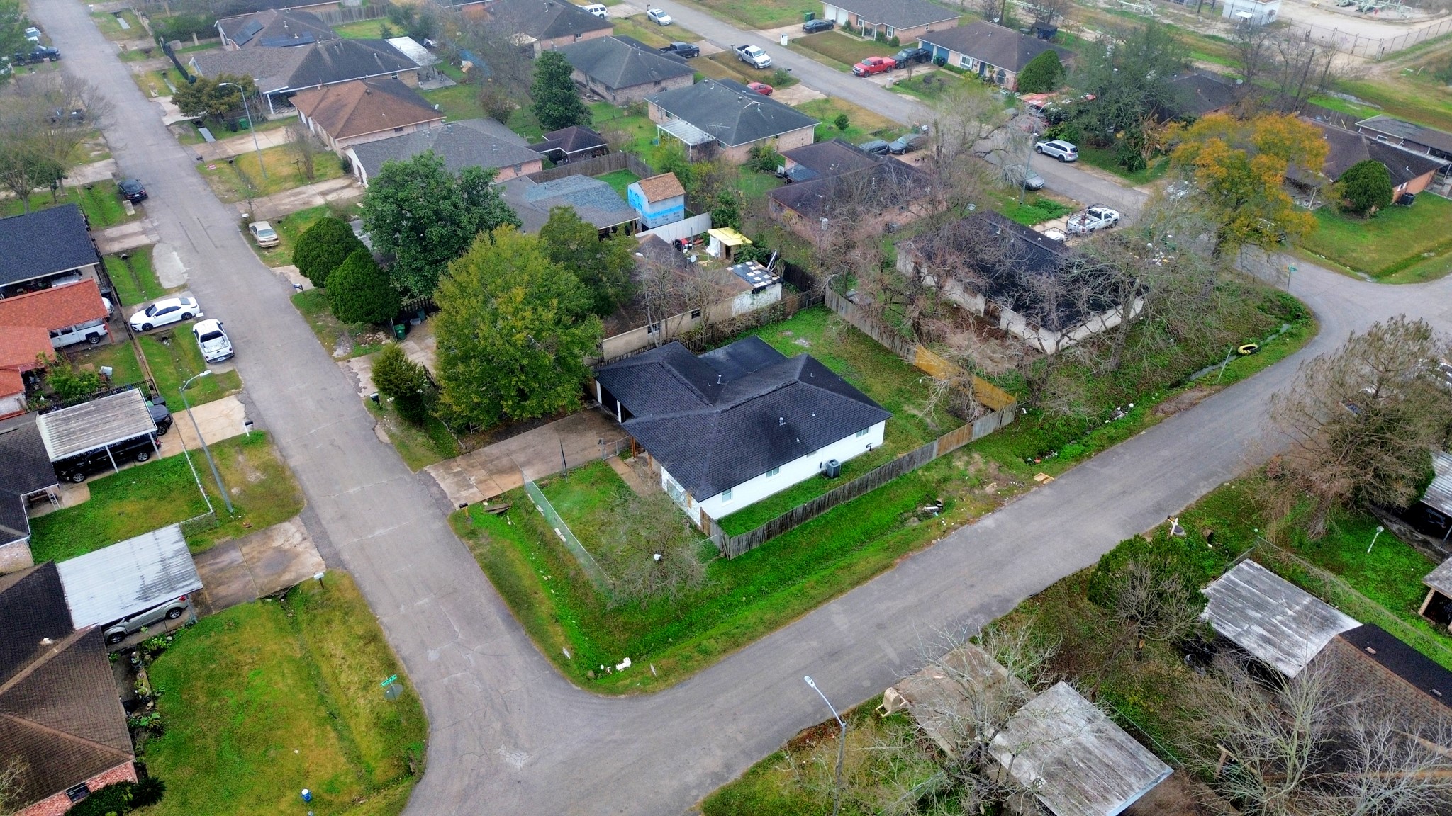 1139 Hartwick Road Houston, TX 77037 - Photo 7 of 38 an aerial view of a house with a yard and lake