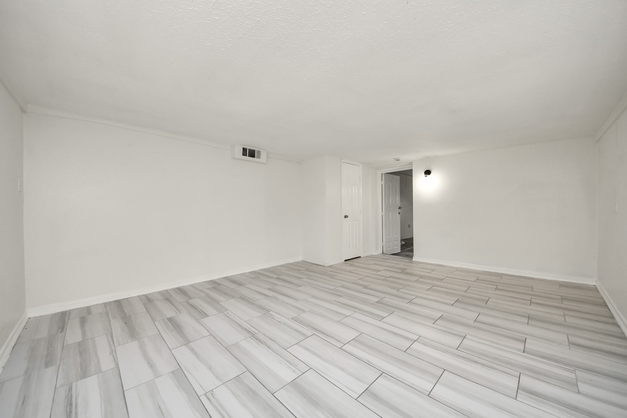 1139 Hartwick Road Houston, TX 77037 - Photo 9 of 38 a view of empty room with wooden floor