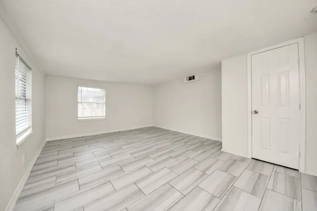 an empty room with windows