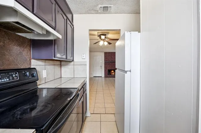 a kitchen with a stove and a microwave