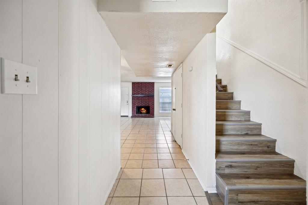 7504 Chapin Road Fort Worth, TX 76116 - Photo 2 of 30 a view of entryway and hall with wooden floor
