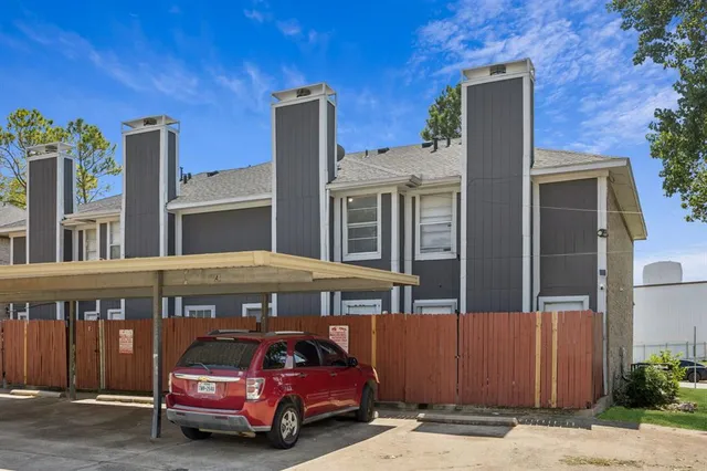 a front view of a building with parking space