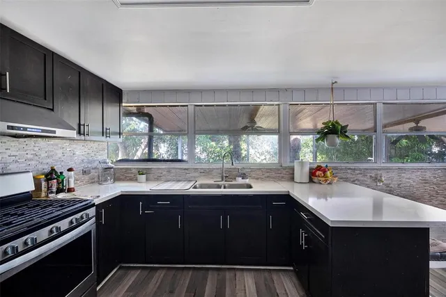 a kitchen with a sink and cabinets
