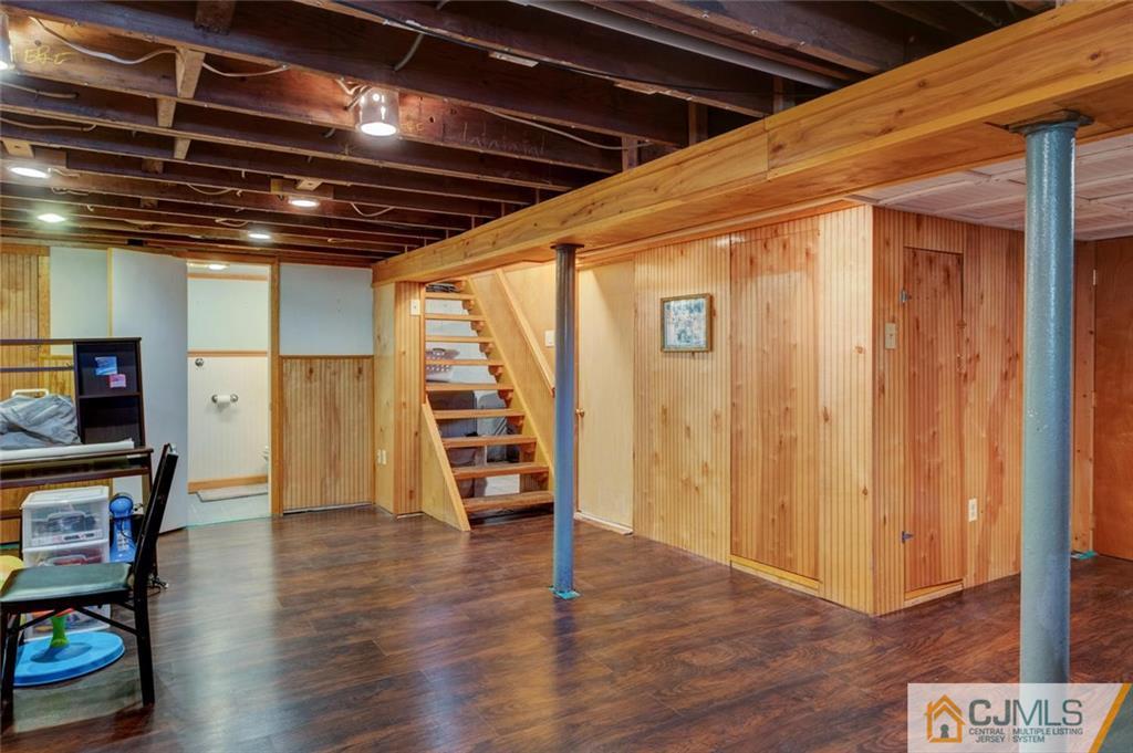 187 Oxford Road Colonia, NJ 07067 - Photo 22 of 25 a view of an empty room with wooden floor and a window