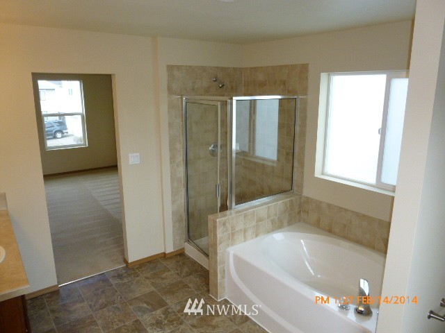 1314 190th Street Southeast Bothell, WA 98012 - Photo 22 of 23 a bathroom with a bathtub and a shower