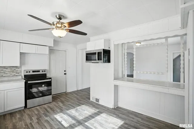 a kitchen with stainless steel appliances a stove and a refrigerator