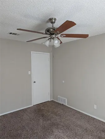 a view of a chandelier fan in a room