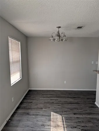 wooden floor in a hall with a window
