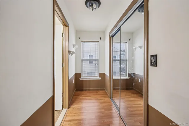 a spacious bathroom with a tub sink and mirror