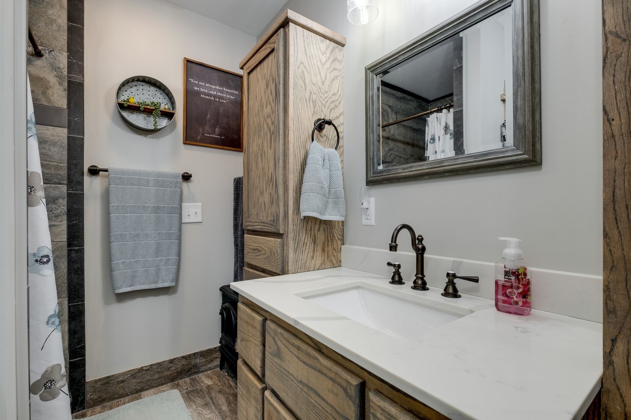 1043 Murphy Hollow Road Vanleer, TN 37181 - Photo 28 of 68 a bathroom with a sink vanity and a mirror