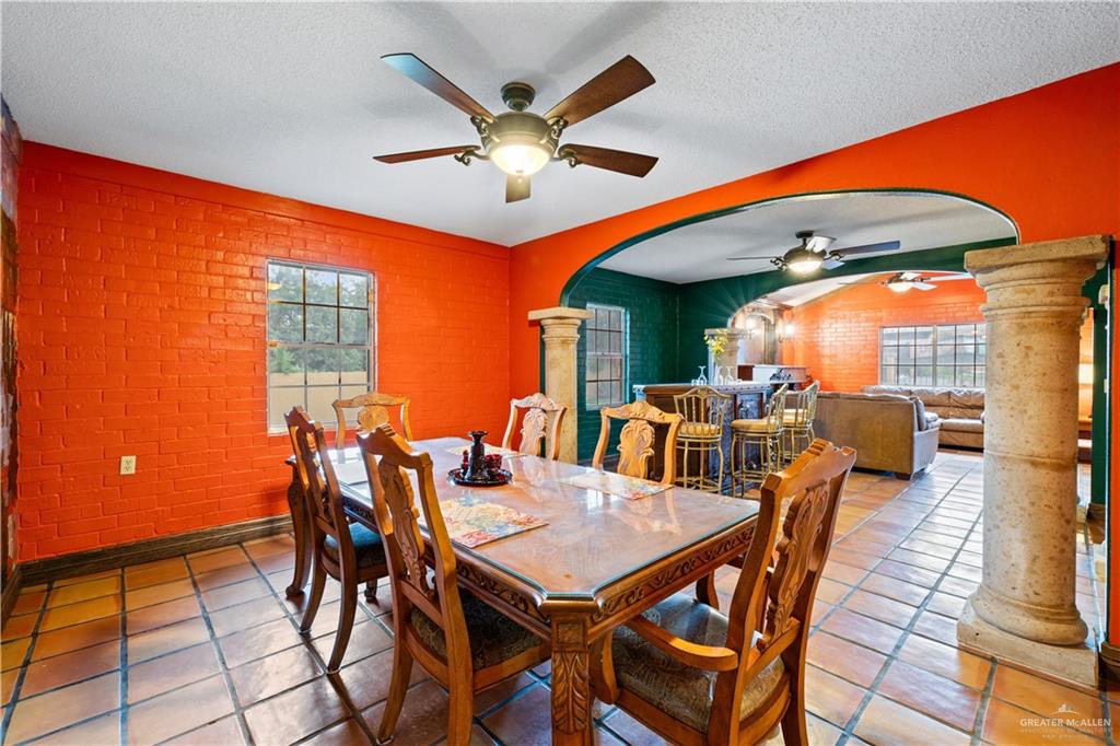 610 North Texas Street Rio Grande City, TX 78582 - Photo 8 of 23 a dining room with furniture and a large window