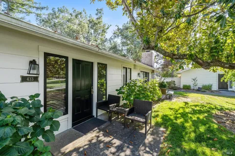 a view of backyard with patio