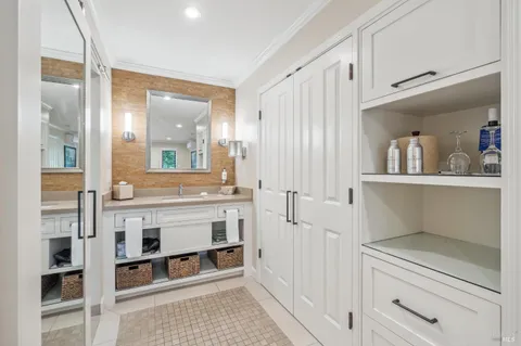 a bathroom with a sink a mirror and a shower