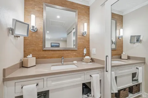 a bathroom with a sink and a mirror