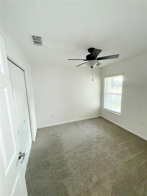 4448 Reding Way Lakeland, FL 33813 - Photo 14 of 26 a view of empty room with ceiling fan