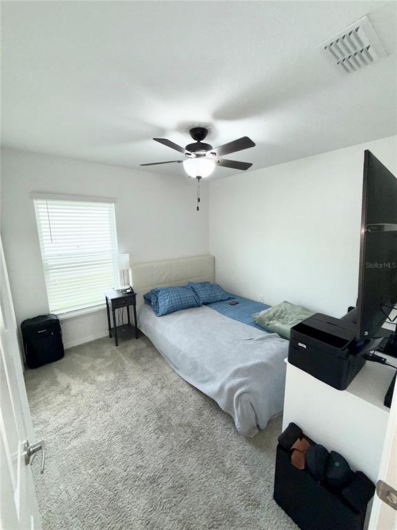 4448 Reding Way Lakeland, FL 33813 - Photo 15 of 26 a bedroom with furniture and a window