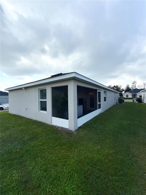 4448 Reding Way Lakeland, FL 33813 - Photo 25 of 26 a view of a house with a yard