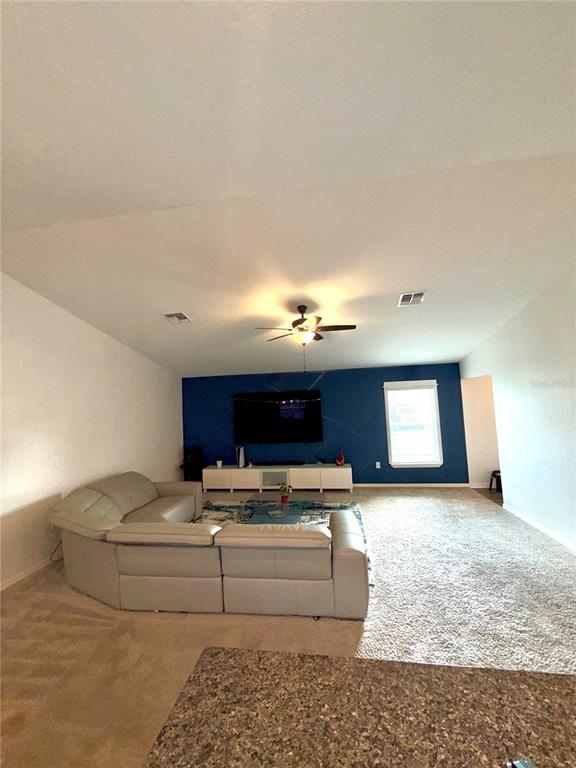 4448 Reding Way Lakeland, FL 33813 - Photo 6 of 26 a living room with furniture and kitchen view