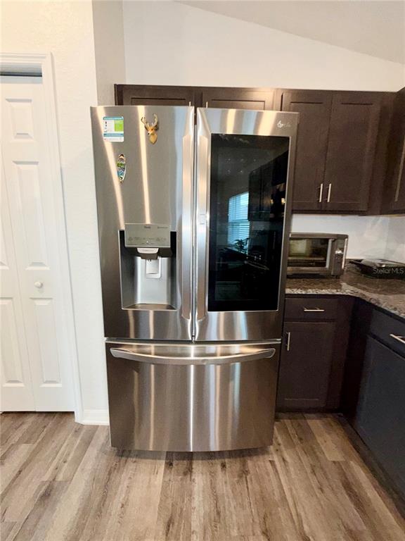 4448 Reding Way Lakeland, FL 33813 - Photo 9 of 26 a kitchen with kitchen island a counter top space and stainless steel appliances