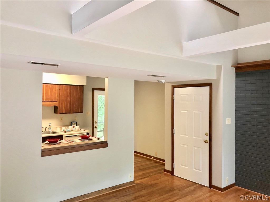 12036 Quito Road Midlothian, VA 23112 - Photo 5 of 26 a room with wooden floor and sink