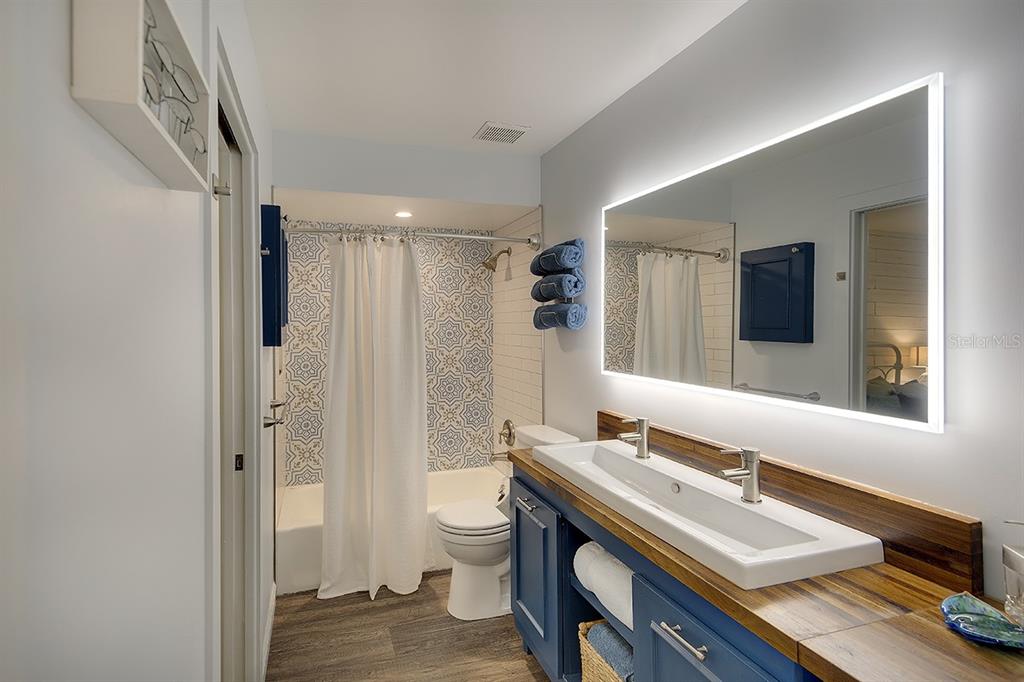 2224 Eugene Street Sarasota, FL 34231 - Photo 19 of 45 a bathroom with a sink a toilet and shower