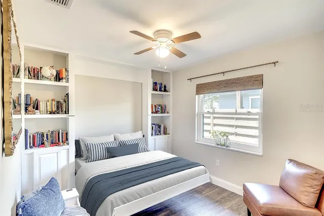 a bed room with a bed and a window