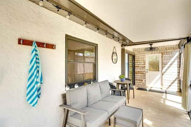 a living room with furniture and a window