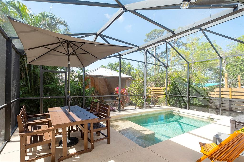 2224 Eugene Street Sarasota, FL 34231 - Photo 30 of 45 a view of a swimming pool with a patio