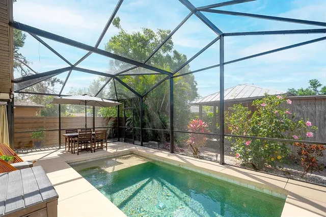 a patio view with a table and chairs