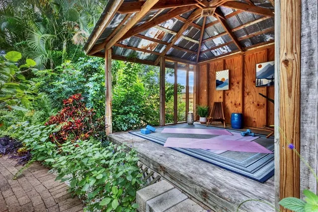 a view of a chairs and table in the patio