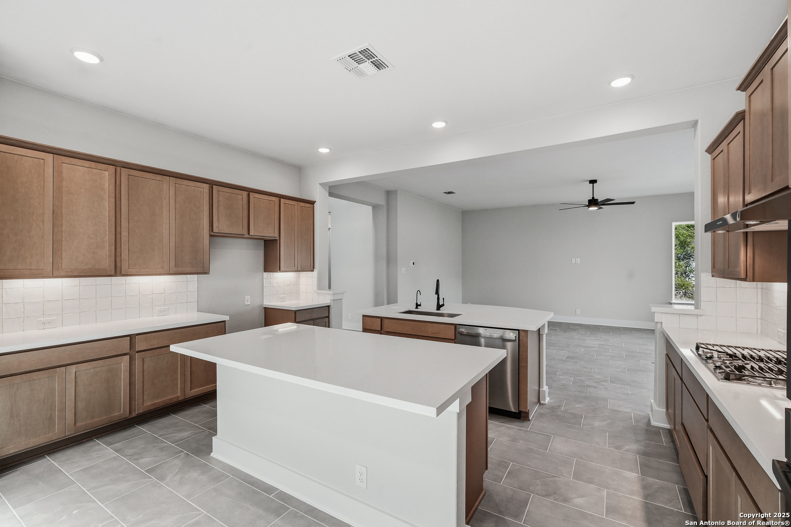 233 Sasparilla Boerne, TX 78006 - Photo 20 of 60 a kitchen that has a sink and a stove in it