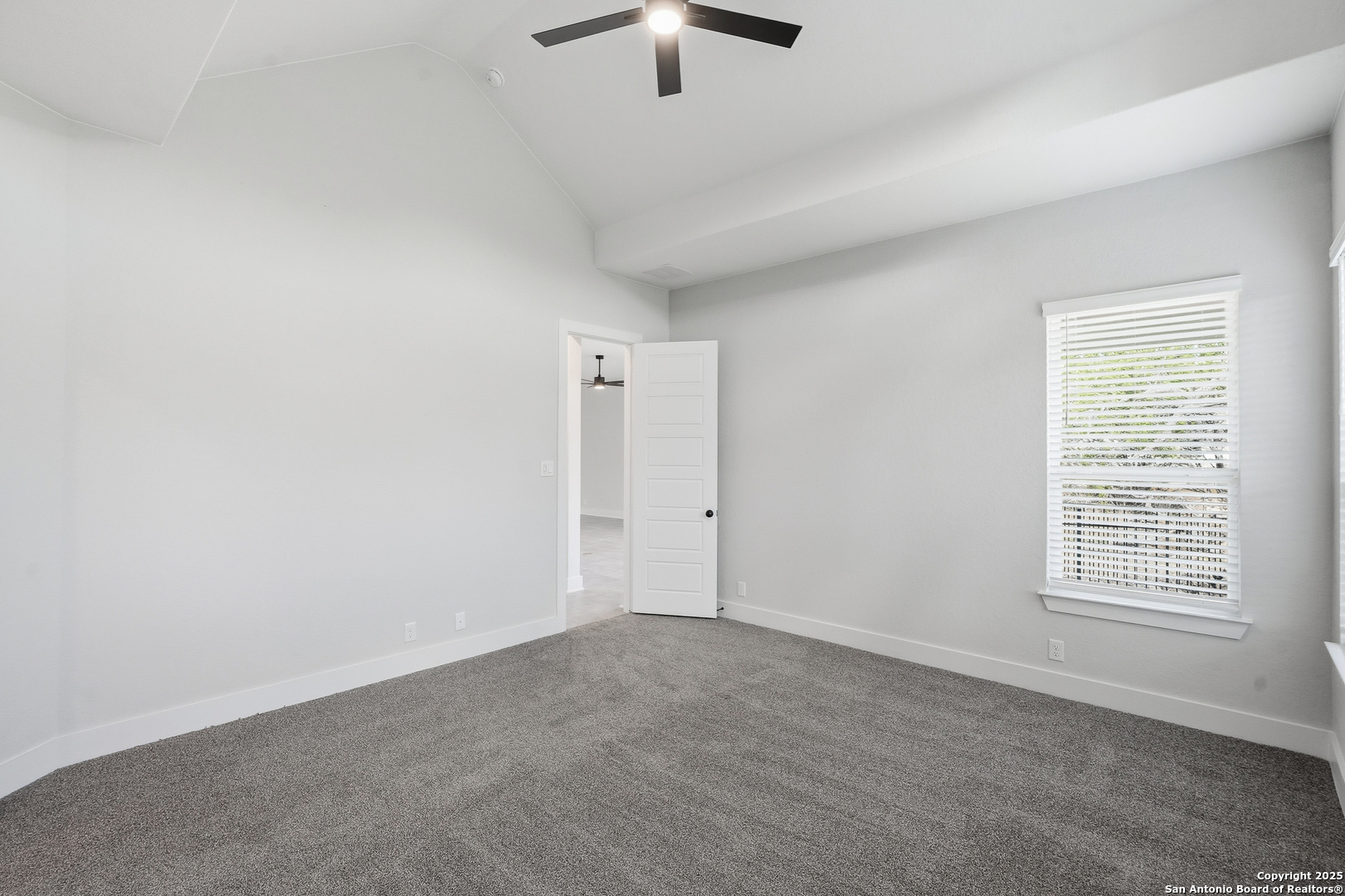 233 Sasparilla Boerne, TX 78006 - Photo 24 of 60 an empty room with chandelier fan and windows