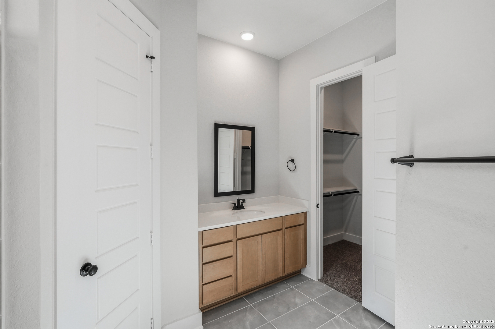 233 Sasparilla Boerne, TX 78006 - Photo 28 of 60 a room with two mirror and a walk in closet