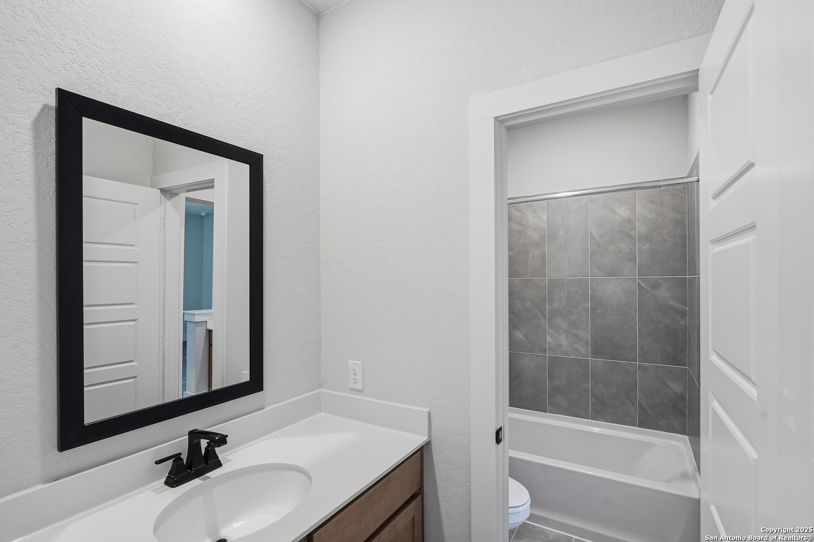 233 Sasparilla Boerne, TX 78006 - Photo 41 of 60 a bathroom with a sink and a mirror