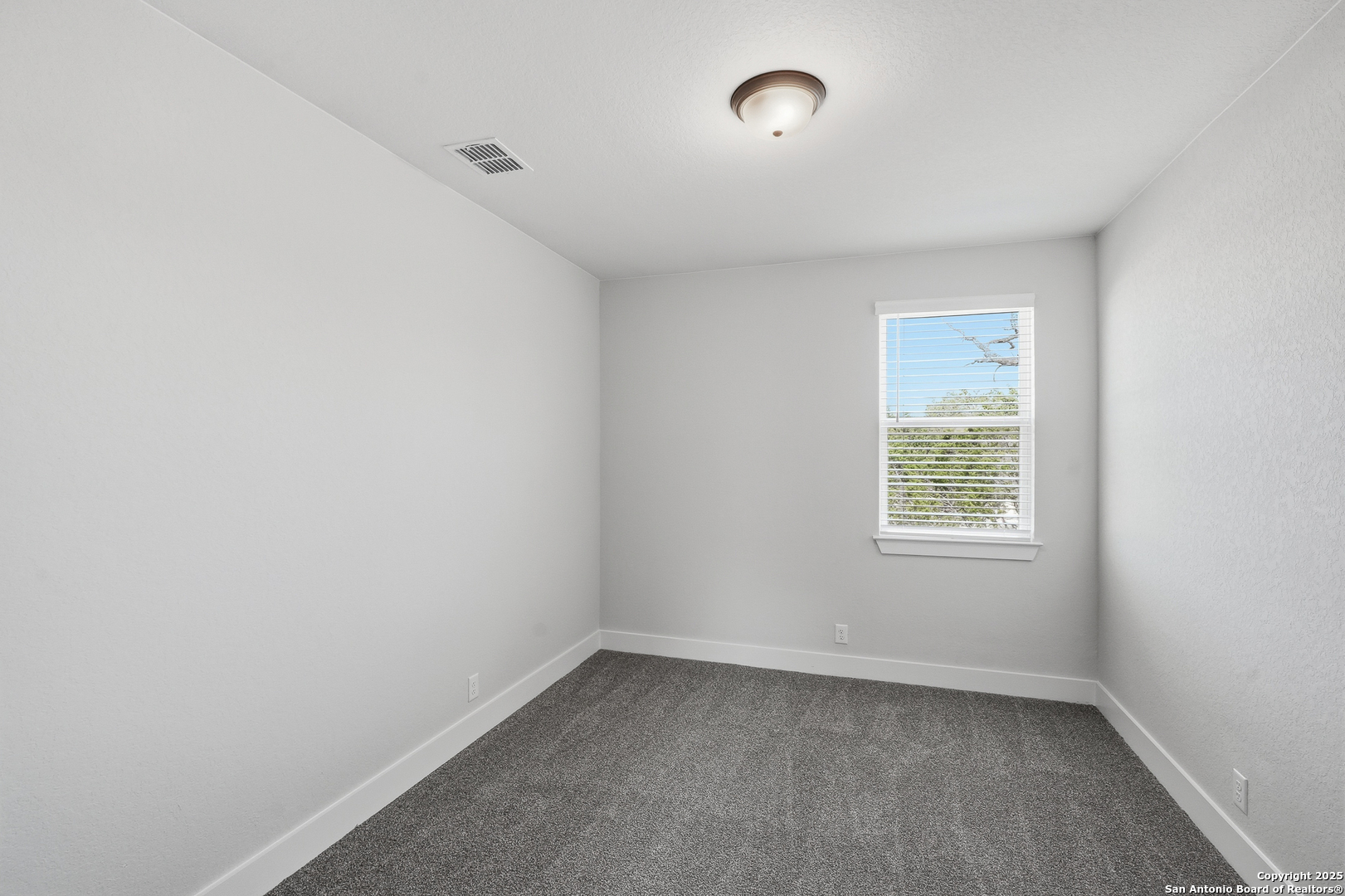 233 Sasparilla Boerne, TX 78006 - Photo 42 of 60 an empty room with a window