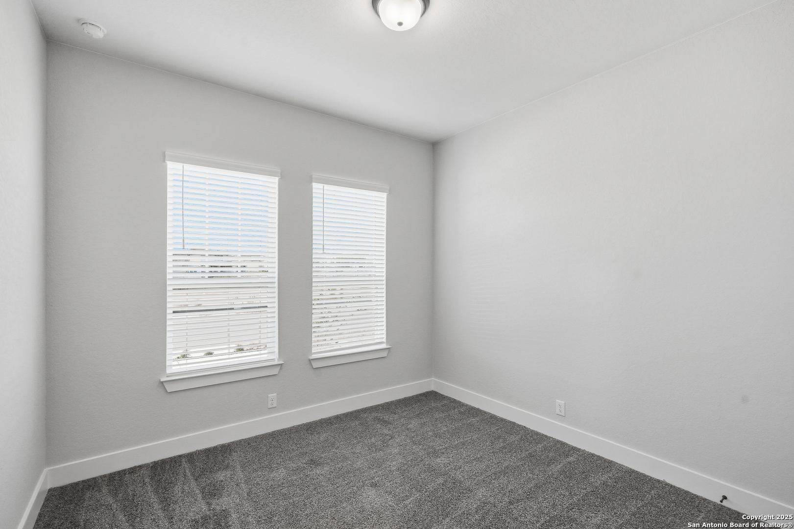 233 Sasparilla Boerne, TX 78006 - Photo 8 of 60 an empty room with windows