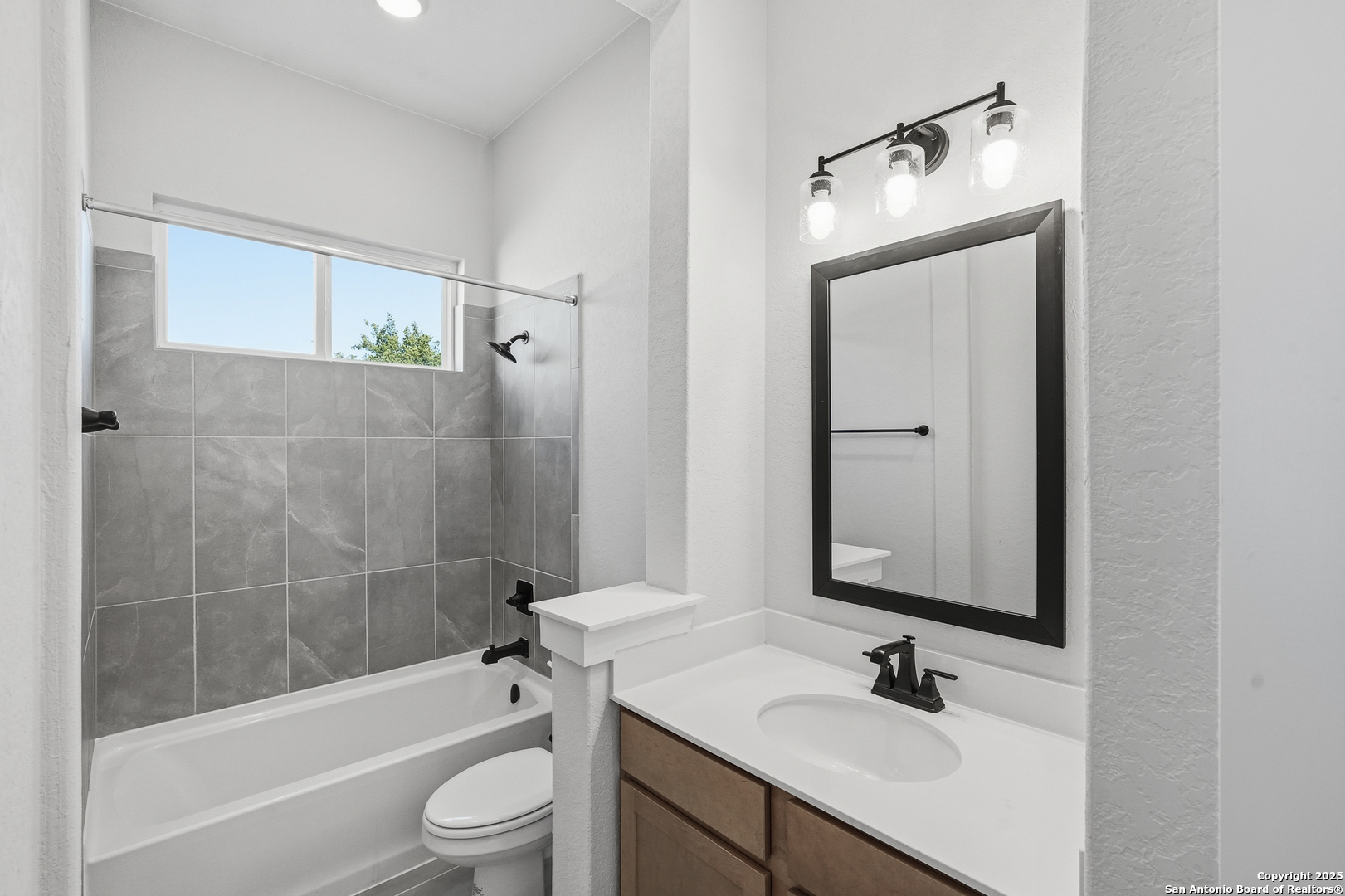 233 Sasparilla Boerne, TX 78006 - Photo 9 of 60 a bathroom with a sink a toilet and shower