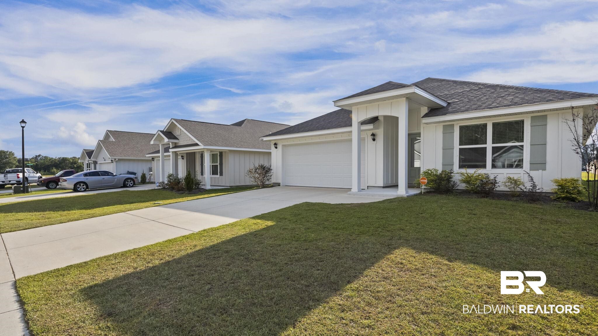 24264 Veranda Circle Elberta, AL 36530 - Photo 4 of 41 Single story home with roof with shingles, driveway, and a front lawn